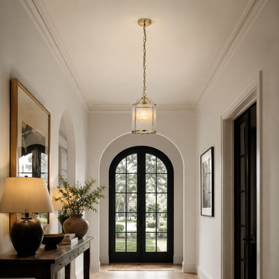 Halo Petite Antique Brass Ribbed Glass Pendant, in a room setting